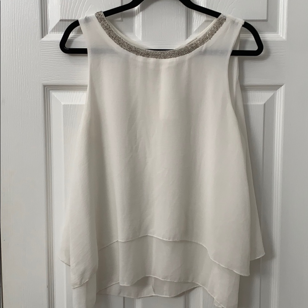 White sleeveless blouse
